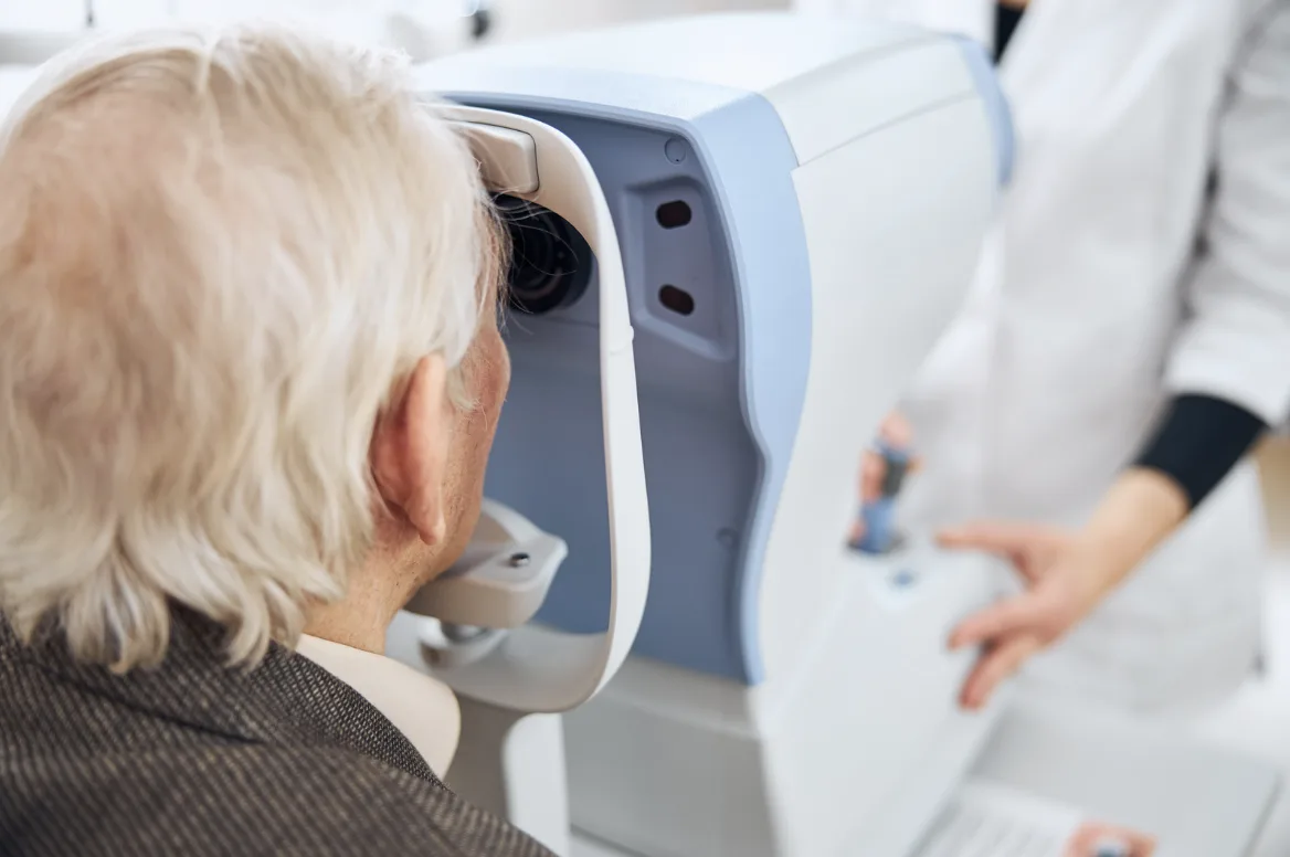 Elderly patient receiving an eye pressure test during a glaucoma screening in Singapore.